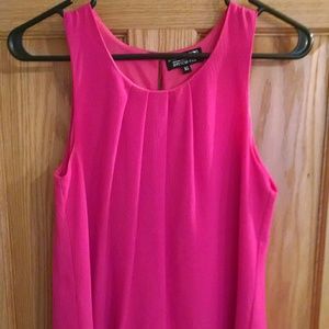 Bright pink sleeveless blouse